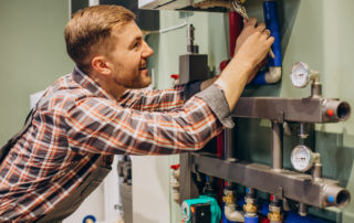 Young Engineer Adjusting Autonomous Heating