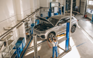 Auto Mechanic Checking Car