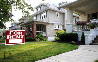 Home For Rent Sign In Front Of Beautiful American Home