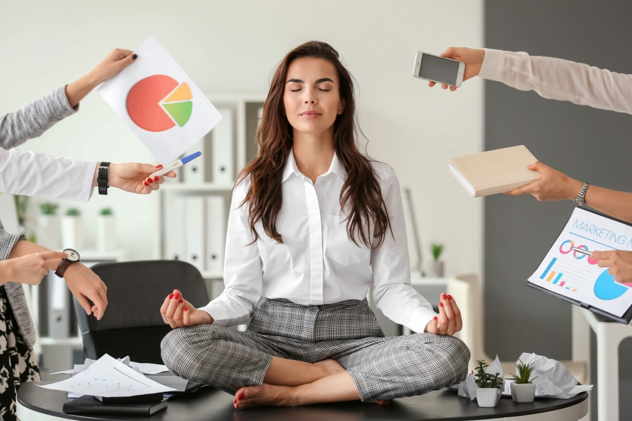 Businesswoman With A Lot Of Work To Do Meditating In Office