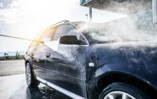 High Pressure Washing Car Outdoors. Car Washing Under The Open Sky.