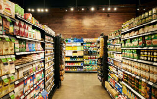 Shot Of Fully Stocked Isles In A Grocery Store During The Day
