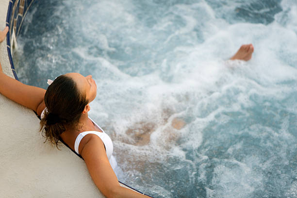 Attractive Woman Relaxing In A Whirlpool Hot Tub