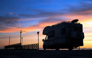 Caravan On The Road And Bridge At SunsetSEE MORE RELATED IMAGES